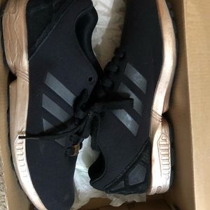 Black and gold adidas